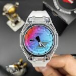 ساعت جيشاک2100سفيد شيشه شفاف عقربه رنگي